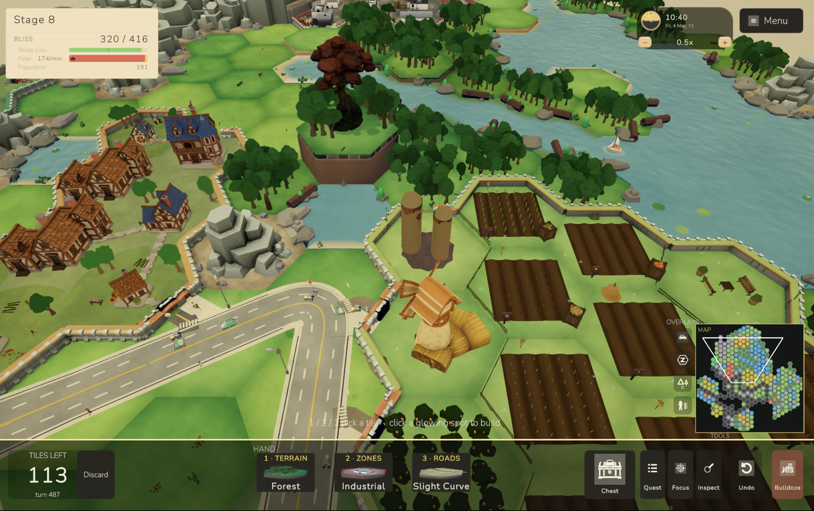 A farm section with silos and a windmill beside a half-timbered village